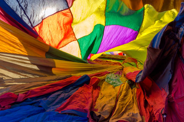 A huge flame in the foreground of the interior of a hot air balloon