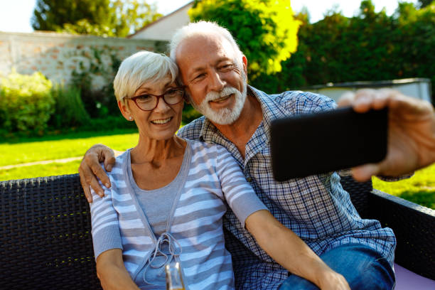istock Senior couple making a selfie outdoor in back yard 1055674026