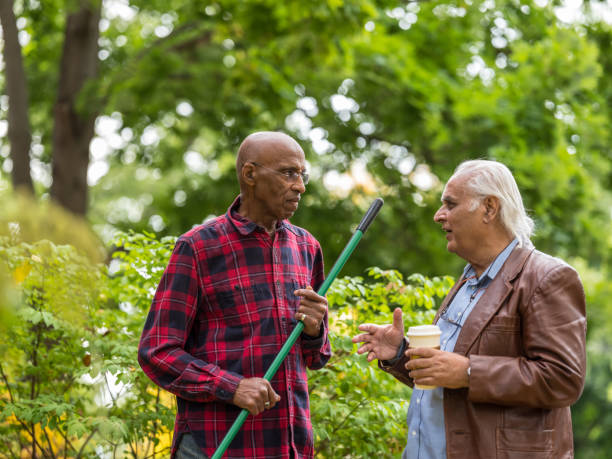 istock Senior neighbors friendly talk 1055680740