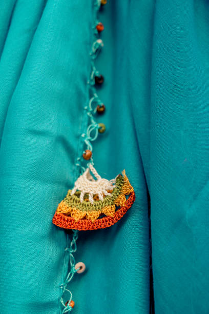 istock Colorful needle work embroidery flowers as a background 1055681060