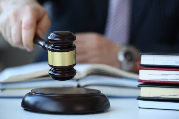 istock Judge holding hammer in hand lies 1055682810