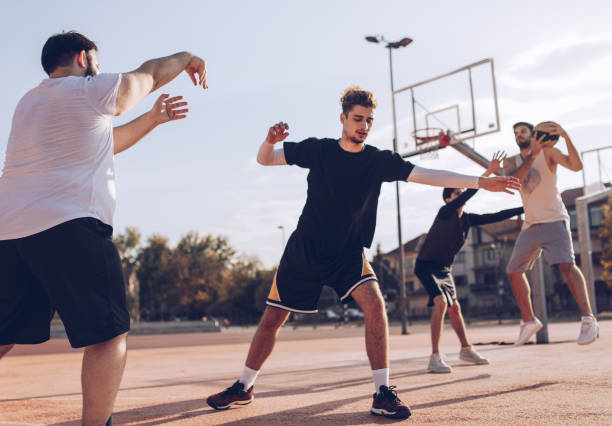 istock Friends playing streetball 1055684058