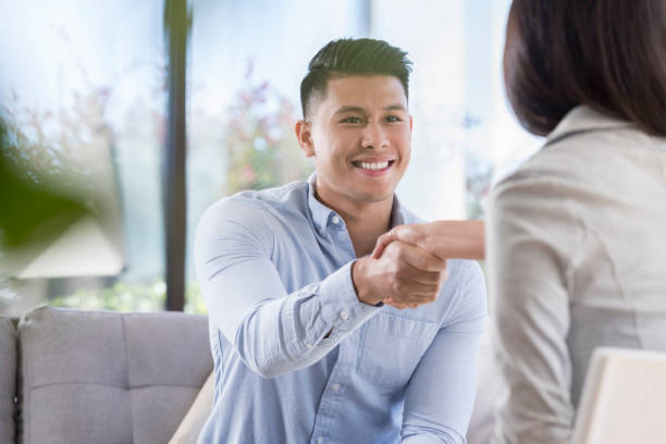 istock Businessman greets colleague 1055689296