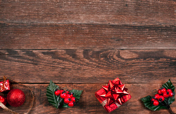 istock Gift box, christmas branches with berries and red balls 1055689674