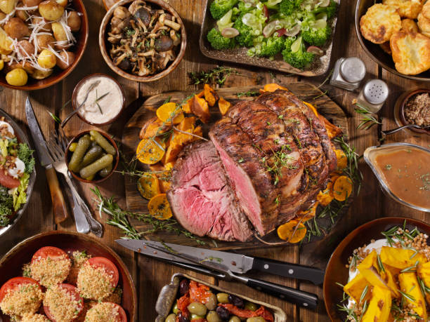 Roast Beef Feast Roast Beef Feast with Yorkshire Pudding, Potatoes, Broccoli, Salad and Gravy carving set stock pictures, royalty-free photos & images