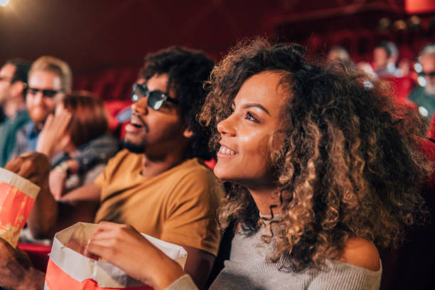 istock Smiling woman watching a movie 1055693490