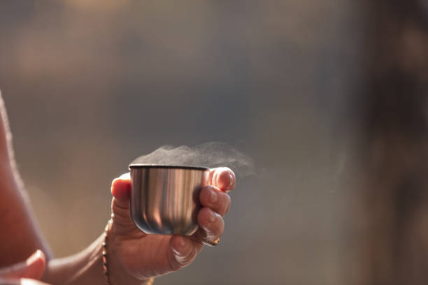 istock Person holding a cup of coffee 1055693942