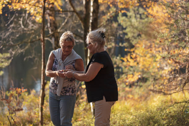 istock Senior ladies walking in forest 1055694266