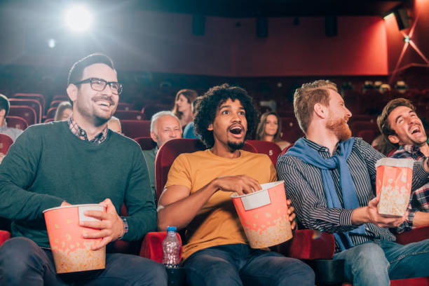 istock Smiling men at cinema 1055694836