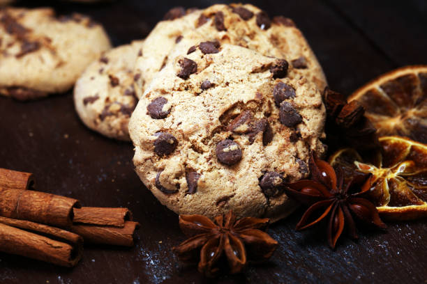 istock Chocolate cookies on rustic table. Chocolate chip cookies shot 1055694902