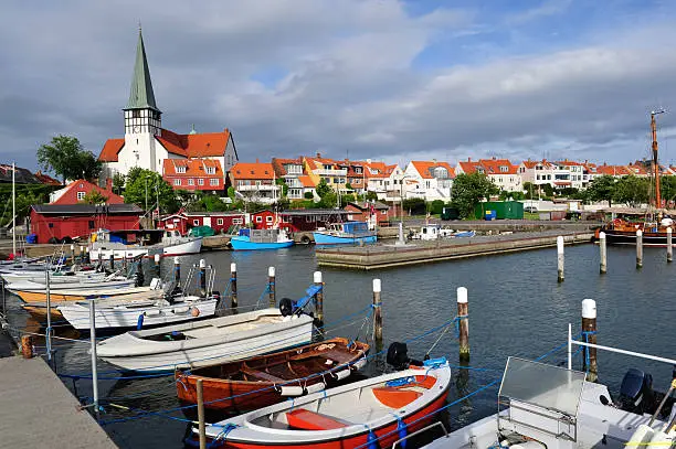 Roenne harbor and church seen from the sea, Bornholm, Denmark