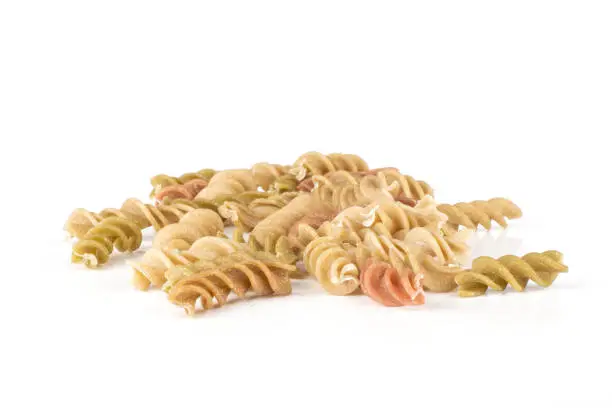 Set of lot of whole raw pasta fusilli variety isolated on white background