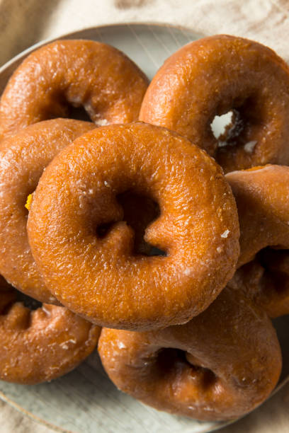 istock Homemade Pumpkin Spice Donuts 1055707726