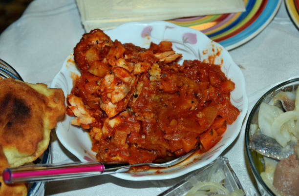 istock Greek style fish in tomato sauce 1055710902