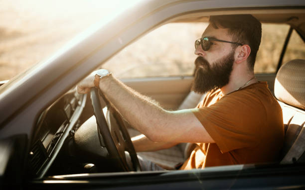 istock Young man traveling by car 1055714524