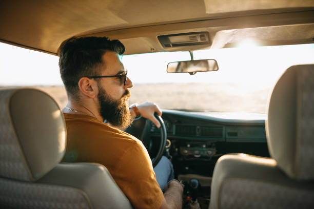istock Young man traveling by car 1055714698