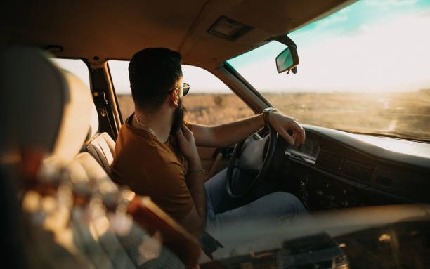 istock Hipster man traveling by car 1055715164