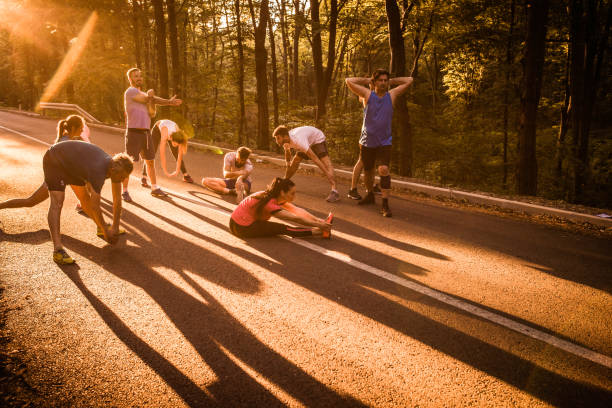 istock Group of runners warming up on a road before the marathon. 1055864772