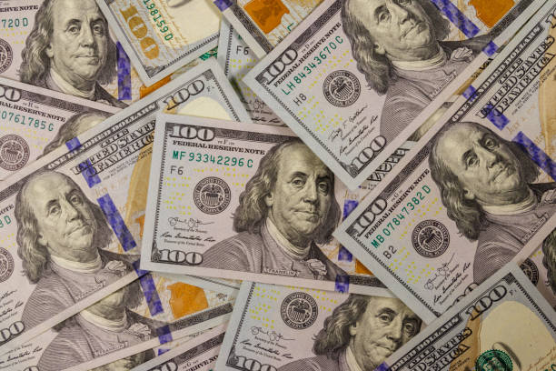 istock Background of one hundred dollar bills 1055865198