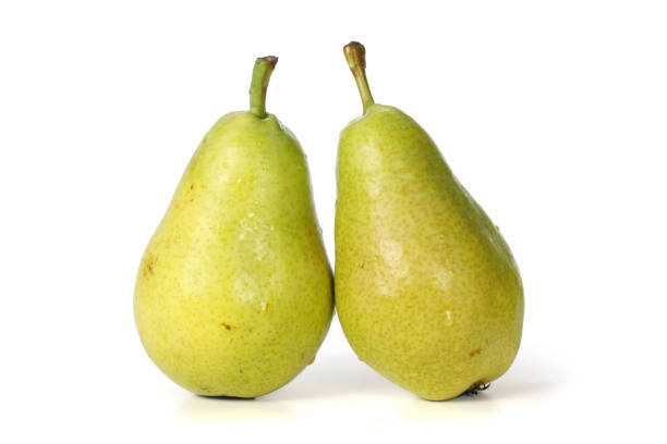 istock ripe green pear isolated on white  background 1055865218