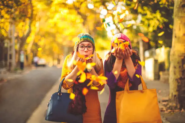 Photo of Young women are having fun in the city - autumn mood