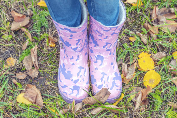 istock children's feet in rubber boots 1055870442