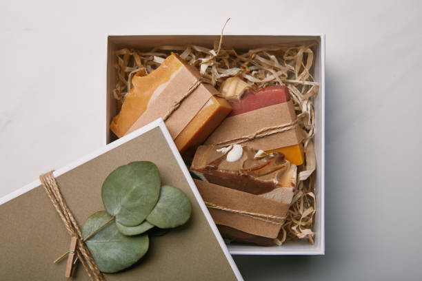 istock top view of box decorated with eucalyptus leaves with soap inside on white marble surface 1055874072