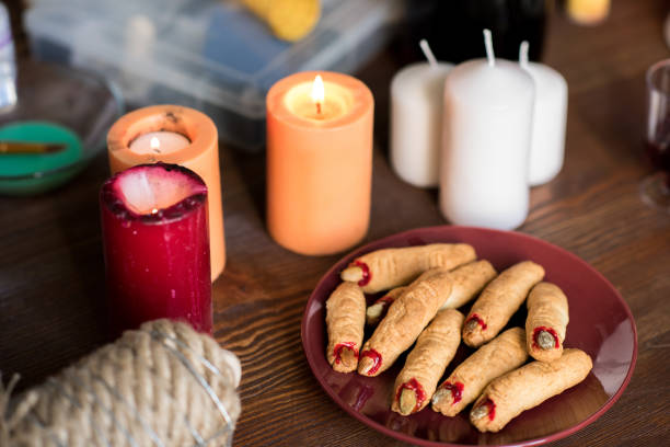 istock Creepy witch finger cookies on plate 1055874338