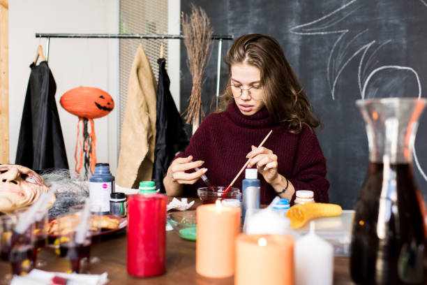 istock Serious woman preparing for painting in workshop 1055874342