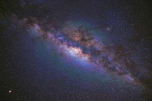 Giant blue alien spiral galaxy in deep space. Concept 3D illustration of fictional galactic stellar milky way supercluster created without third-party elements depicting strange worlds in universe.