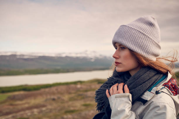 istock Female traveler posing in icelandic wilderness 1055875896