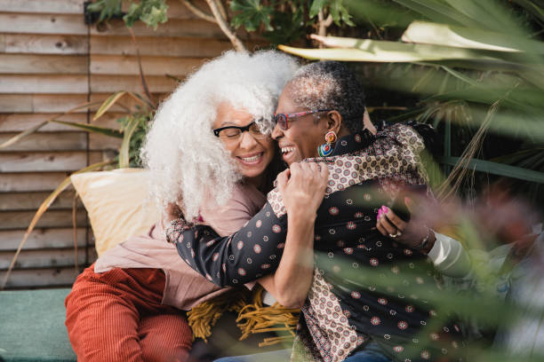 istock Mature Friends Embracing 1055876466