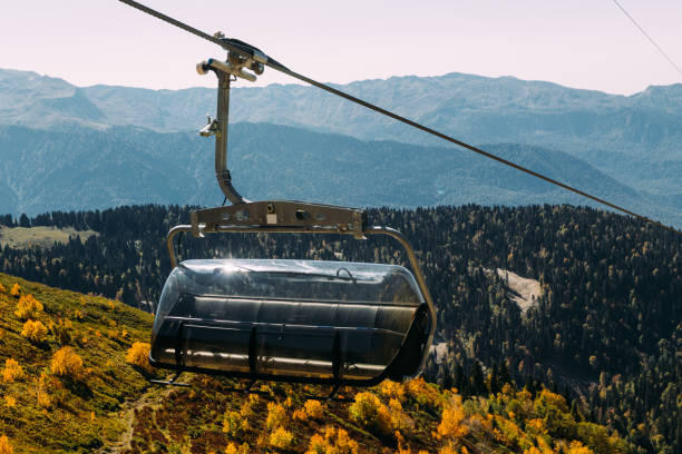 istock Funicular high in the mountains above the autumn forest 1055876920