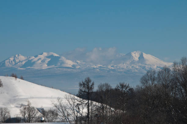 istock Blue sky and winter mountain Daisetuzan 1055879600