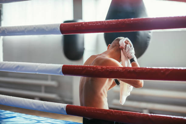istock Boxer wiping the sweat after hard fight 1055879774