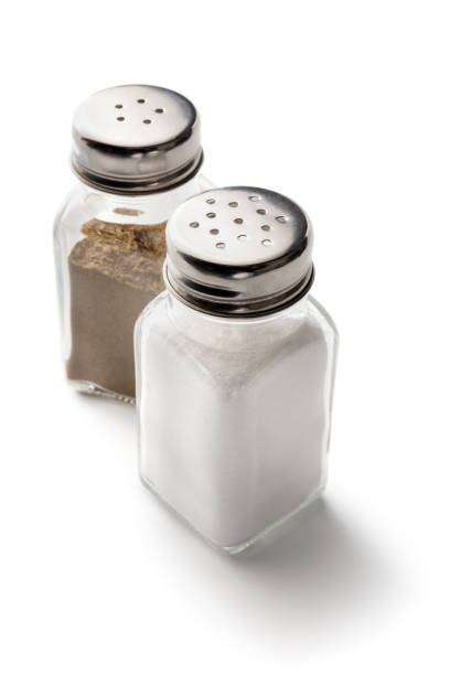 Seasoning: Salt and Pepper Shakers Isolated on White Background Seasoning: Salt and Pepper Shakers Isolated on White Background pepper shaker stock pictures, royalty-free photos & images