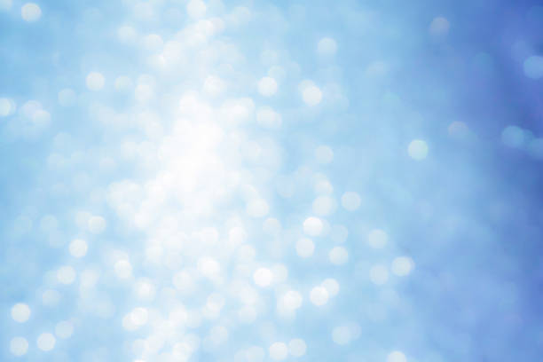 istock Sparkled glitter abstract texture. Beautiful christmas background in light blue colors. Defocused 1055881772