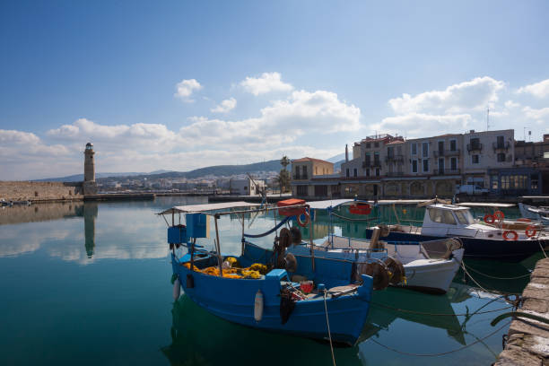 istock Boat in the harbor at Sunset, Greece 1055882042
