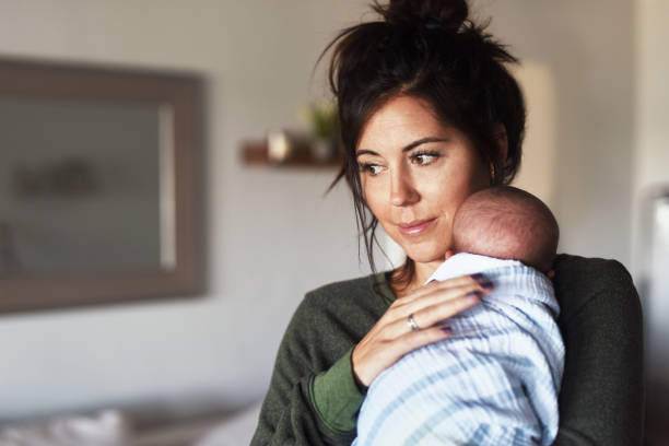 she loves her child so much - baby carrier fotos imagens e fotografias de stock