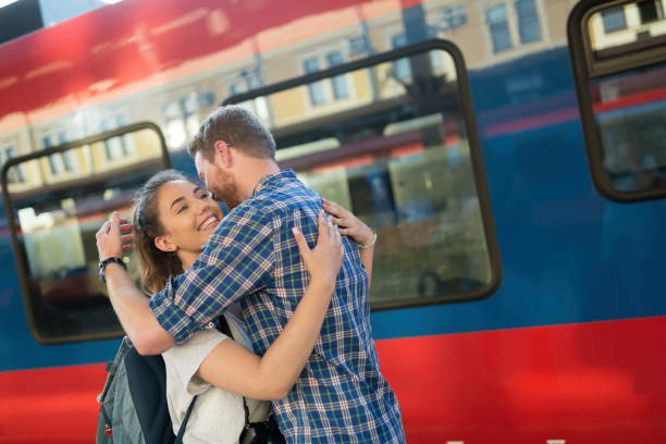 istock Beautiful couple parting at train station 1055887484