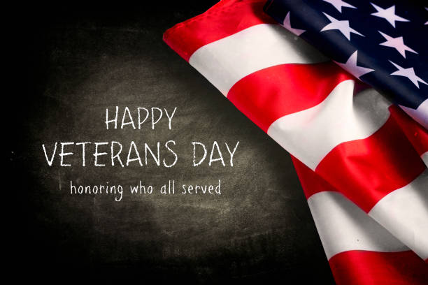 istock Veterans day background with text and USA flag 1055887824