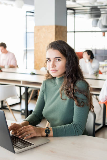 istock Confident attractive woman preparing report in office 1055887844