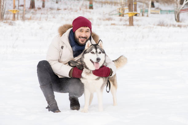 istock Modern Asian Man with Husky Dog 1055888290
