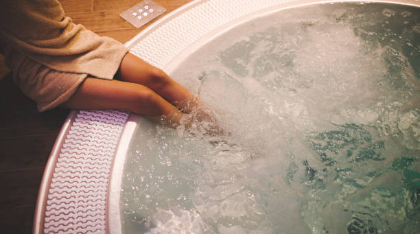 istock Woman enjoying hot tub in spa 1055890884