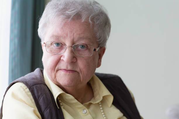 istock serious senior woman portrait 1055891848