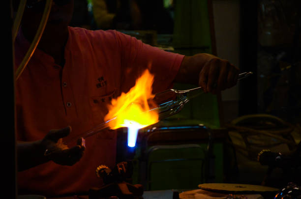 istock Changhua Lukang, Taiwan - MAR 25, 2018:Burning glass ball process. 1055900656