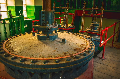 abandoned mining equipment industrial cylinder for water removal in mining shafts water pump cylinder in mine at Prestonpans near Edinburgh Scotland