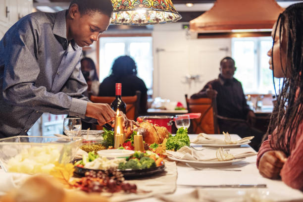 istock African-American preparing thanksgiving dinner 1055904316