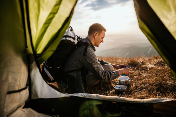 istock Hiking young man and lunch break 1055905728