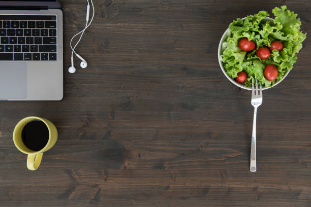 istock Overhead view of desk with laptop 1055910040